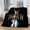 A black flannel throw blanket featuring a graphic of a person with outstretched arms and the text THIS IS IT