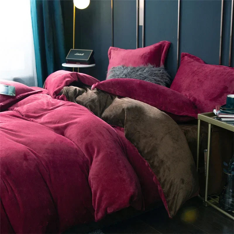 A luxurious deep red flannel duvet cover set displayed on a bed with dark green curtains and gold accents.