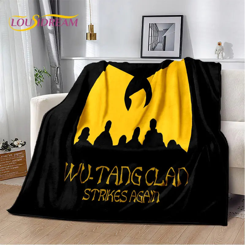 Black flannel throw blanket featuring a yellow silhouette design with the text WU-TANG CLAN STRIKES AGAIN