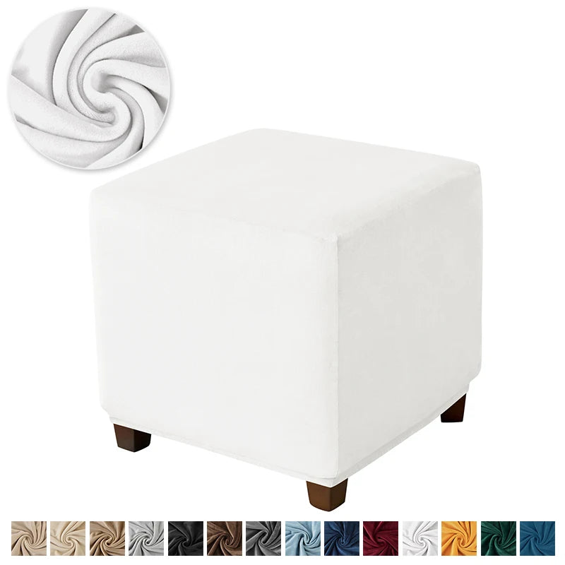 White velvet ottoman slipcover with a decorative swirl pattern.