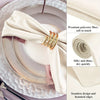 A set of silky satin dinner napkins with gold embroidery and hemmed edges displayed on a silver plate.