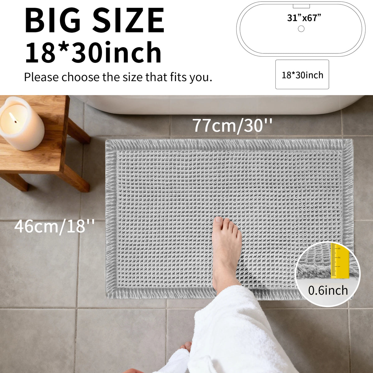 A gray waffle design non-slip bathroom mat is shown placed on a tiled floor, with a foot resting on it.