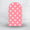 A vertical pink arch backdrop cover patterned with white stars for events