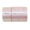 Roll of light pink satin gift ribbon measuring 50mm, 40mm, 25mm, and 20mm wide.