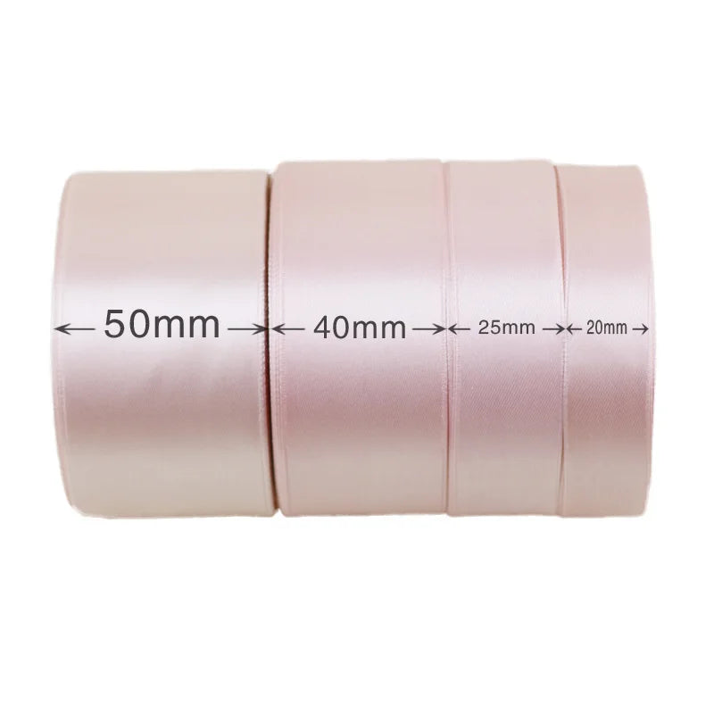 Roll of light pink satin gift ribbon measuring 50mm, 40mm, 25mm, and 20mm wide.