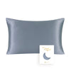 A smooth, slate gray silk pillowcase with a hidden zipper and a crescent moon design.