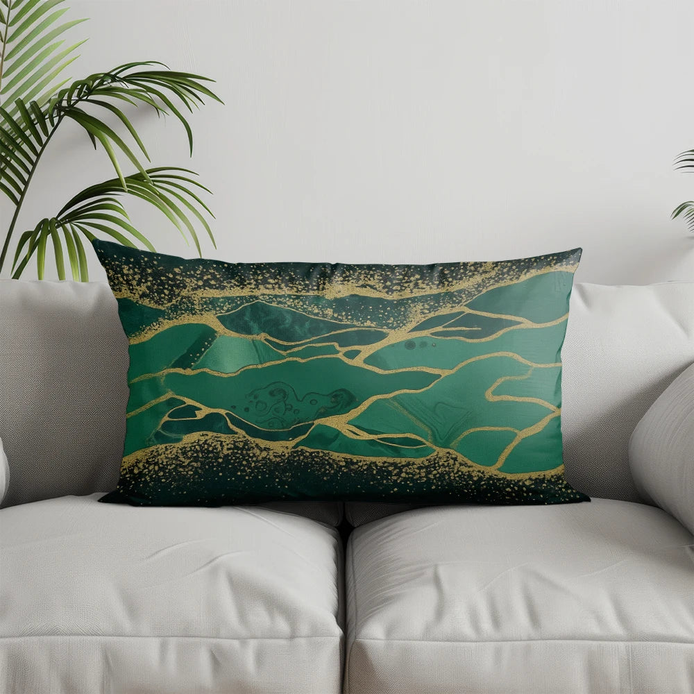 A dark teal pillow cover featuring a geometric pattern of gold lines and speckles.