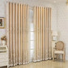 Cream sheer double layer blackout curtains hanging in a light-colored room.