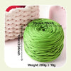 A ball of bright lime green soft T-shirt yarn for crochet with dimensions 12cm/4.72inch and a weight of 280g ±10g.