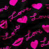A dark fabric with pink script hearts and lips printed on it.