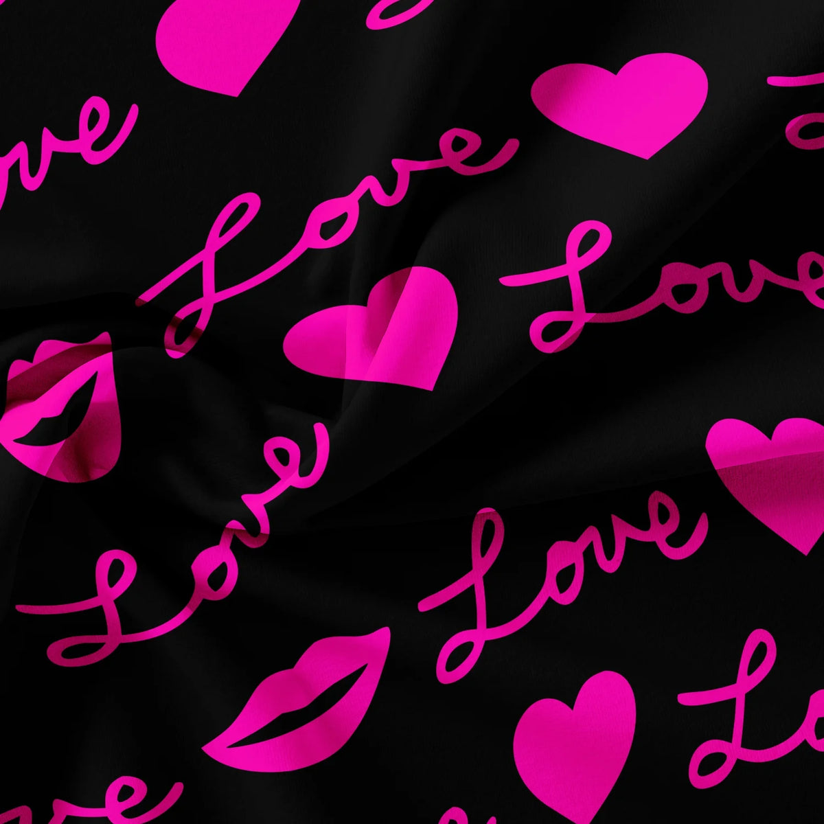 A dark fabric with pink script hearts and lips printed on it.