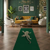 A long emerald green runner rug featuring a silver animal print design on a warm wood floor.