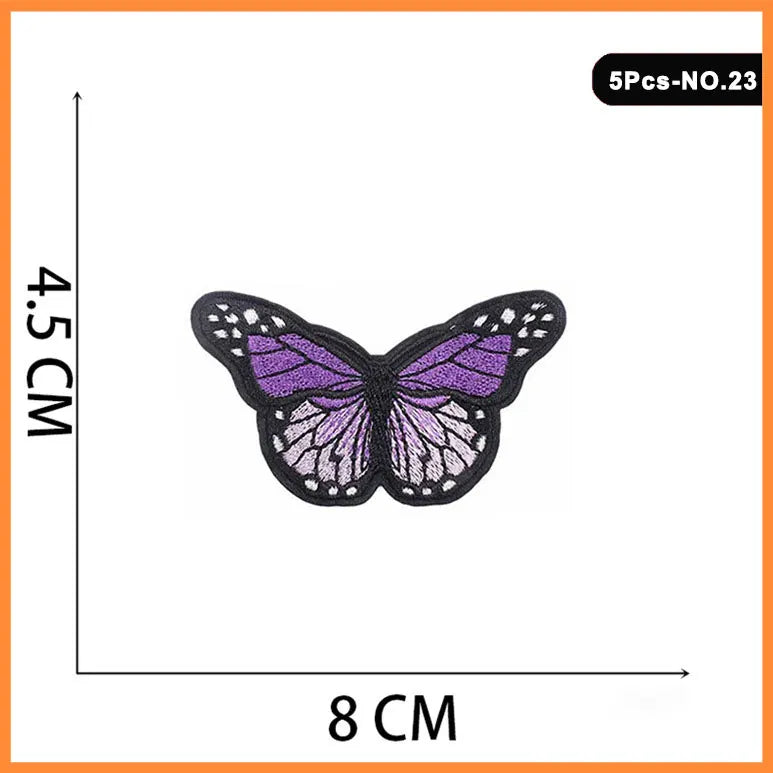 A set of five embroidered iron-on patches featuring purple and pink butterfly designs.