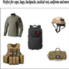 A collection of tactical gear including a military-style shirt, a black backpack, and a tan canvas bag.