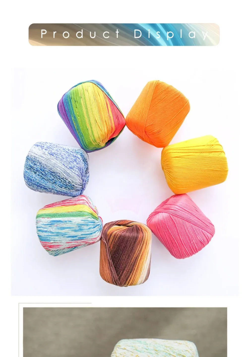 A display of hand knitting yarn in various shades and colors, arranged in a circle.