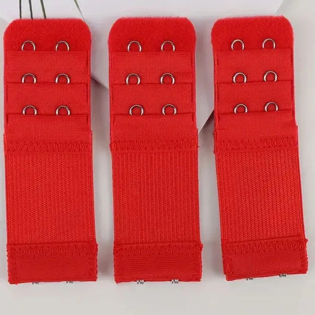 Three bright red adjustable bra extender straps with elastic loops and textured fabric.