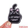 Black embroidered patch of a cat with whiskers and a speech bubble that says I DO WHAT I WANT