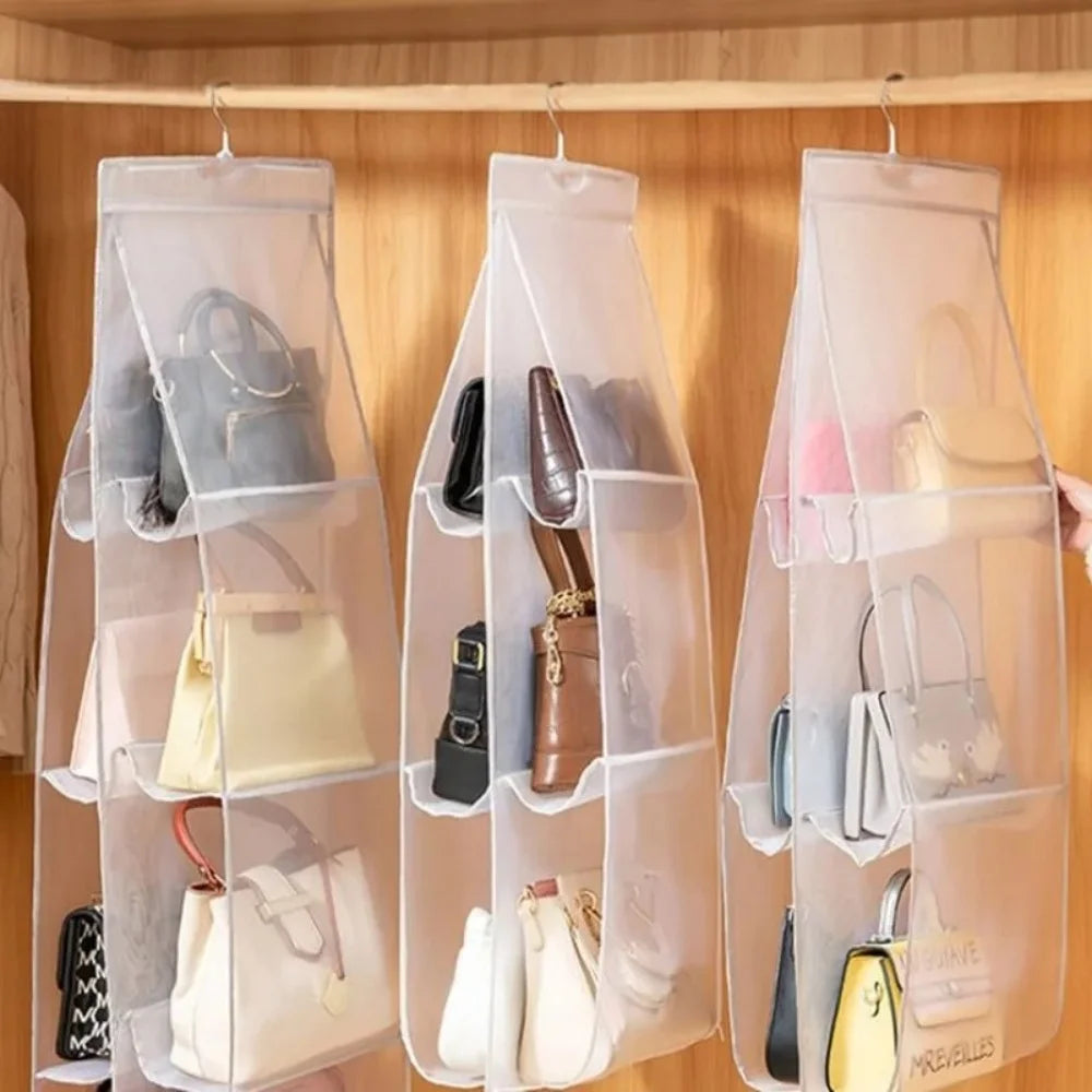A clear hanging closet organizer bag displaying various handbags and accessories.