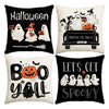 A set of four black and white Halloween themed pillow covers featuring spooky text and ghost designs