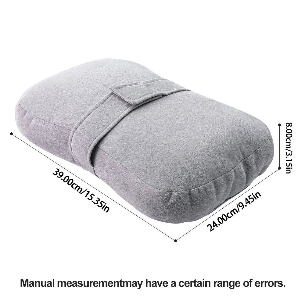 A light gray ergonomic knee pillow designed for side sleepers.