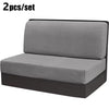 A pair of gray stretch jacquard seat covers for vehicle upholstery shown flat.