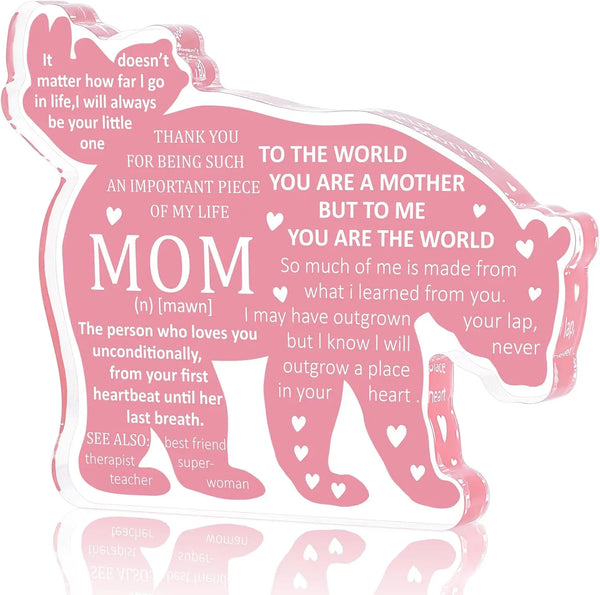 A pink personalized mom plaque keepsake shaped like a paw print with loving messages.