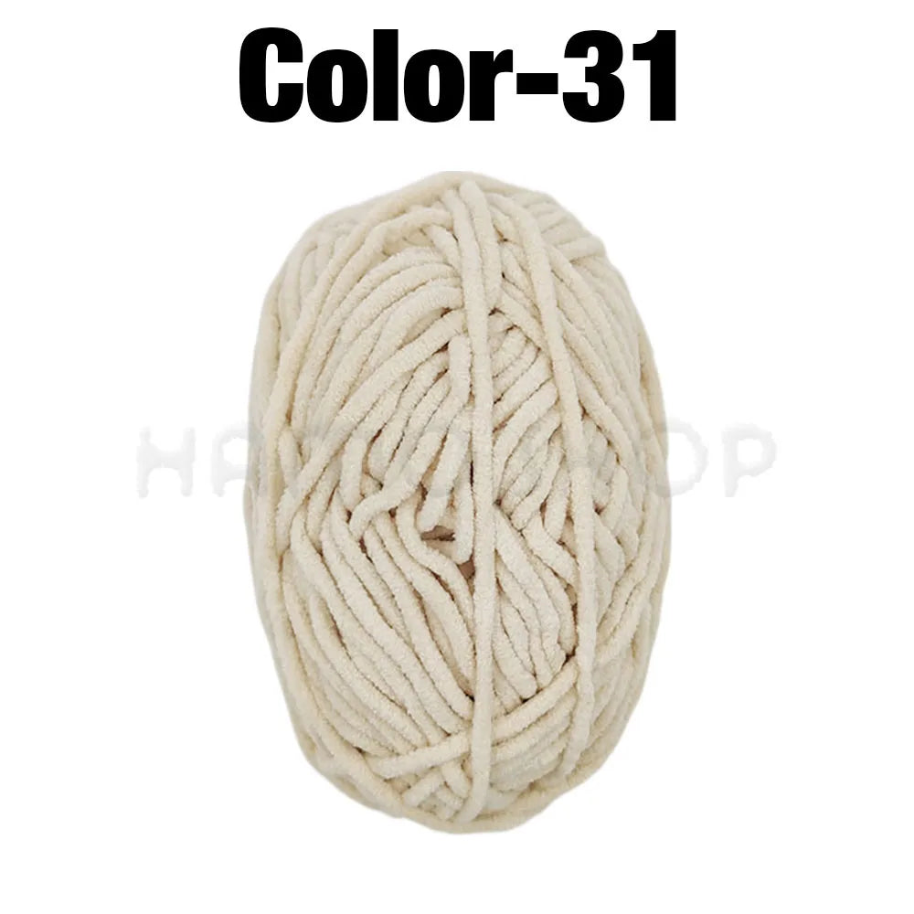 A ball of cream colored soft velvet chenille yarn labeled Color-31 for crafting.