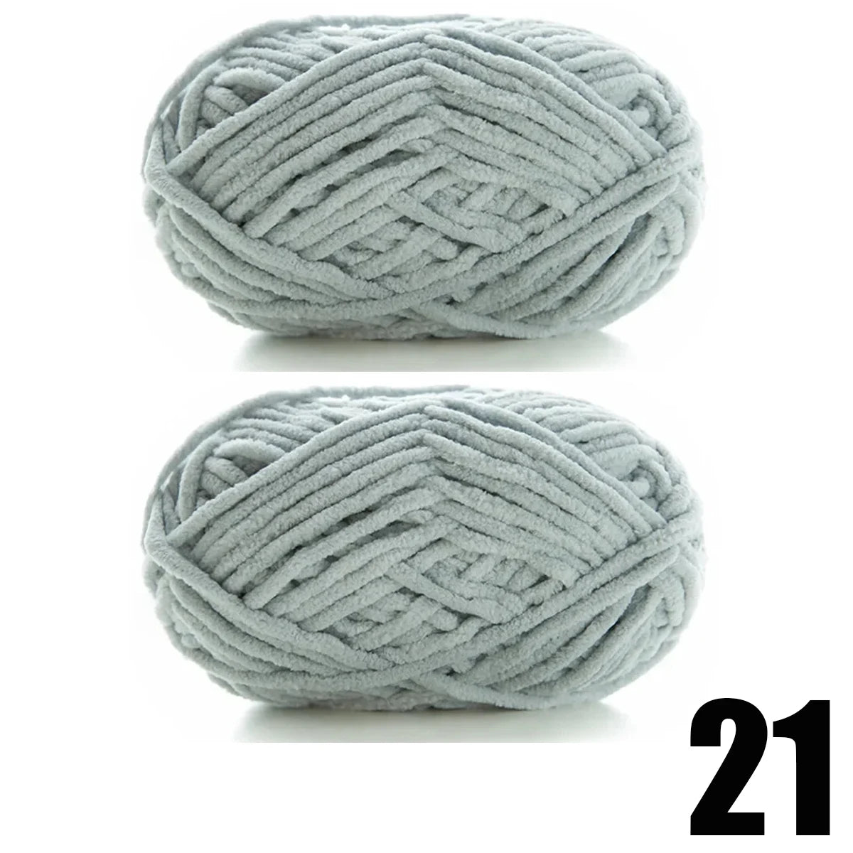 A ball of thick, light gray velvet yarn coiled into a tight, textured skein.