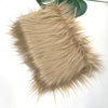 Light beige faux fur plush fabric used for sewing and crafting