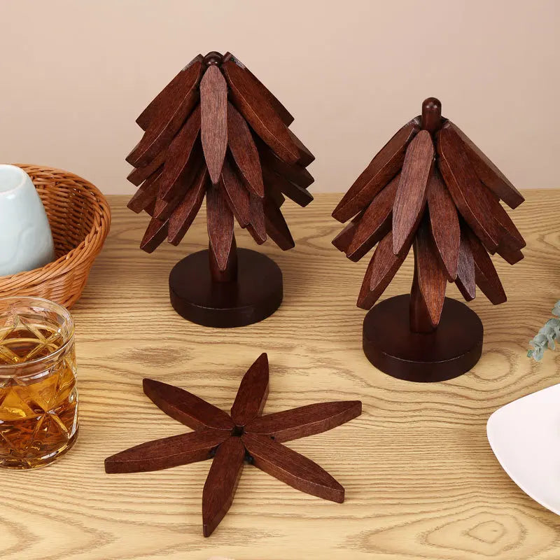 A set of natural wooden coasters featuring pinecone-like designs on dark wooden stands.