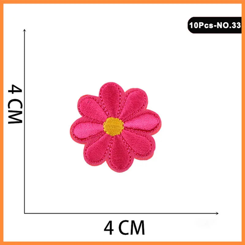 A single pink embroidered flower patch with a yellow center, part of a set of iron-on patches.
