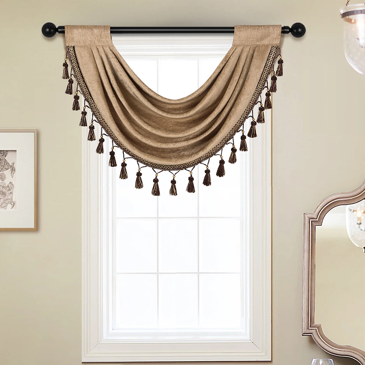 A beige European style window curtain valance with tassels hanging over a white-framed window.