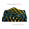 Two pillowcases and one duvet cover featuring a teal and yellow hole pattern.