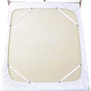A white adjustable bed sheet with corner straps is shown on a wooden bed frame.