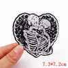 Black embroidery patch featuring a detailed rose skull design on a white background.