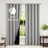 Gray blackout thermal window drapes hanging in a window frame.