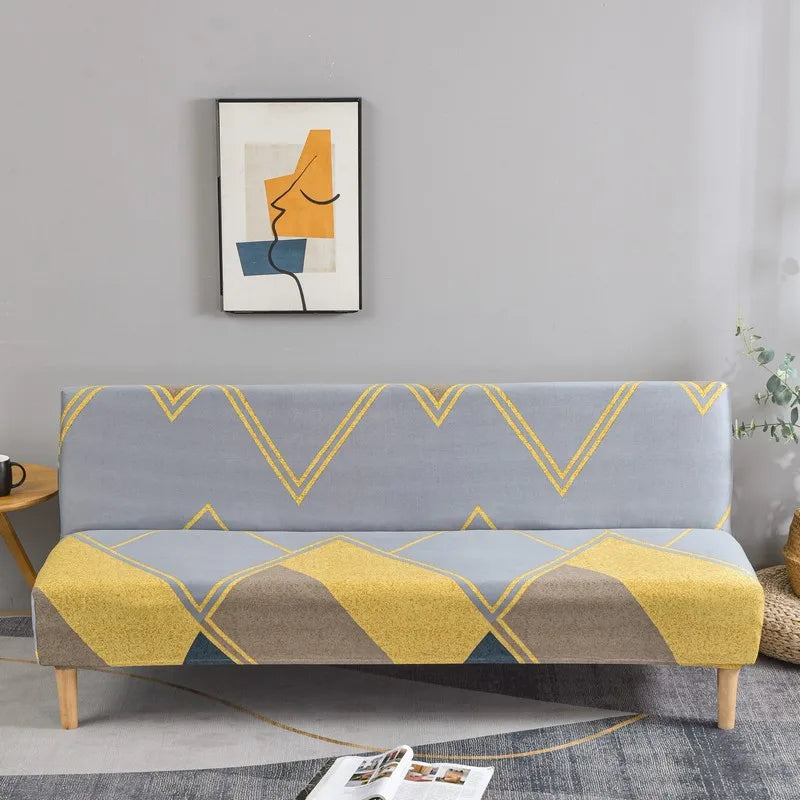 A light gray sofa with yellow and blue geometric print spandex slipcovers sits in a modern living room.