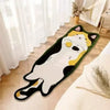 A cartoon cat rug with black and white fur and yellow accents placed on a light wooden floor.
