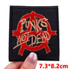 Black embroidered patch featuring the text PUNKS WOLDDEAD in red thread