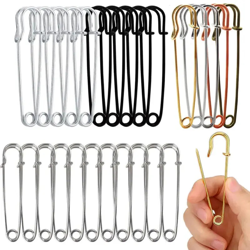 A collection of heavy duty stainless steel safety pins in various sizes and finishes.