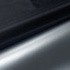 Blackout curtains with adhesive strips shown in a rolled, textured fabric.