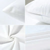 Close-up view of white leopard print decorative pillow covers showing fabric texture and stitching.