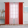 A set of red curtains featuring sheer and blackout window drapes hanging on a rod.