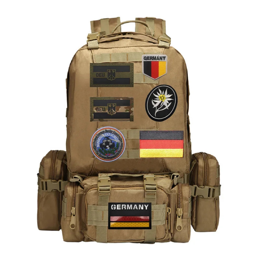 A tan backpack featuring multiple German national emblems and patches.