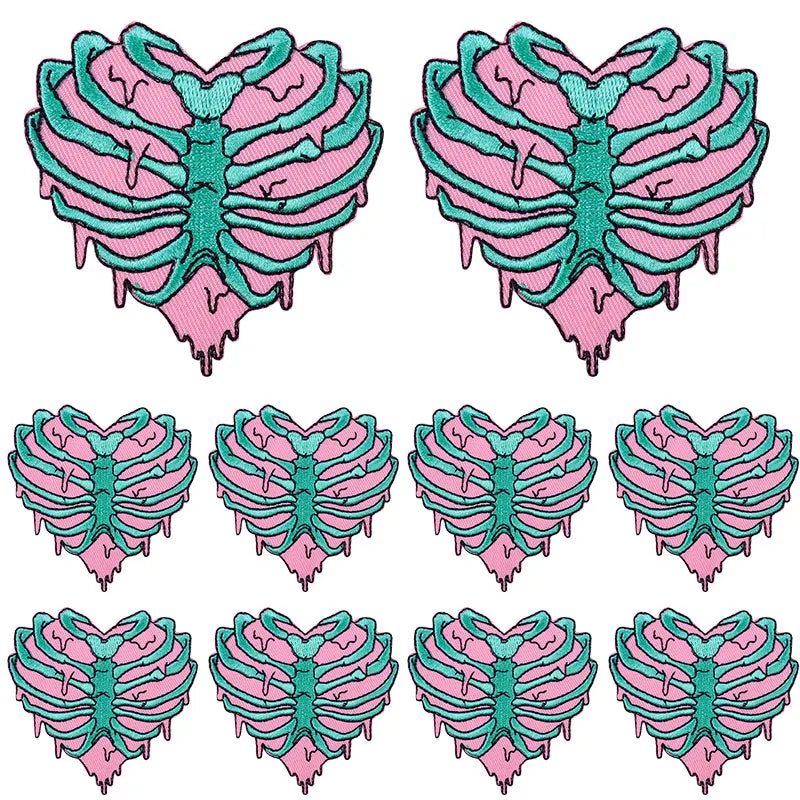 Set of pink and teal DIY punk embroidery patches shaped like a stylized skeleton for clothing