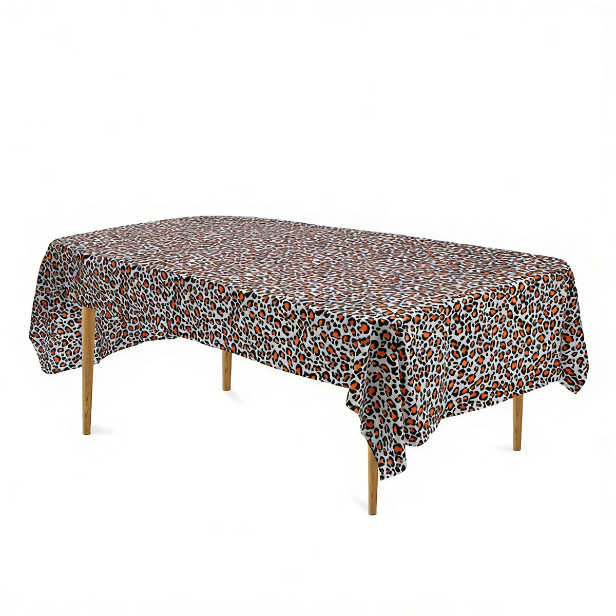 A leopard print disposable plastic tablecloth spread over a wooden table.