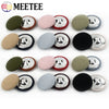 A set of round fabric-covered shank buttons in various colors including olive green, pink, gray, and black.