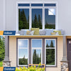 A view showing an indoor window and an outdoor window with privacy film applied, set in a modern building.