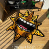A large, orange and black sun motif floor mat with a fierce expression.
