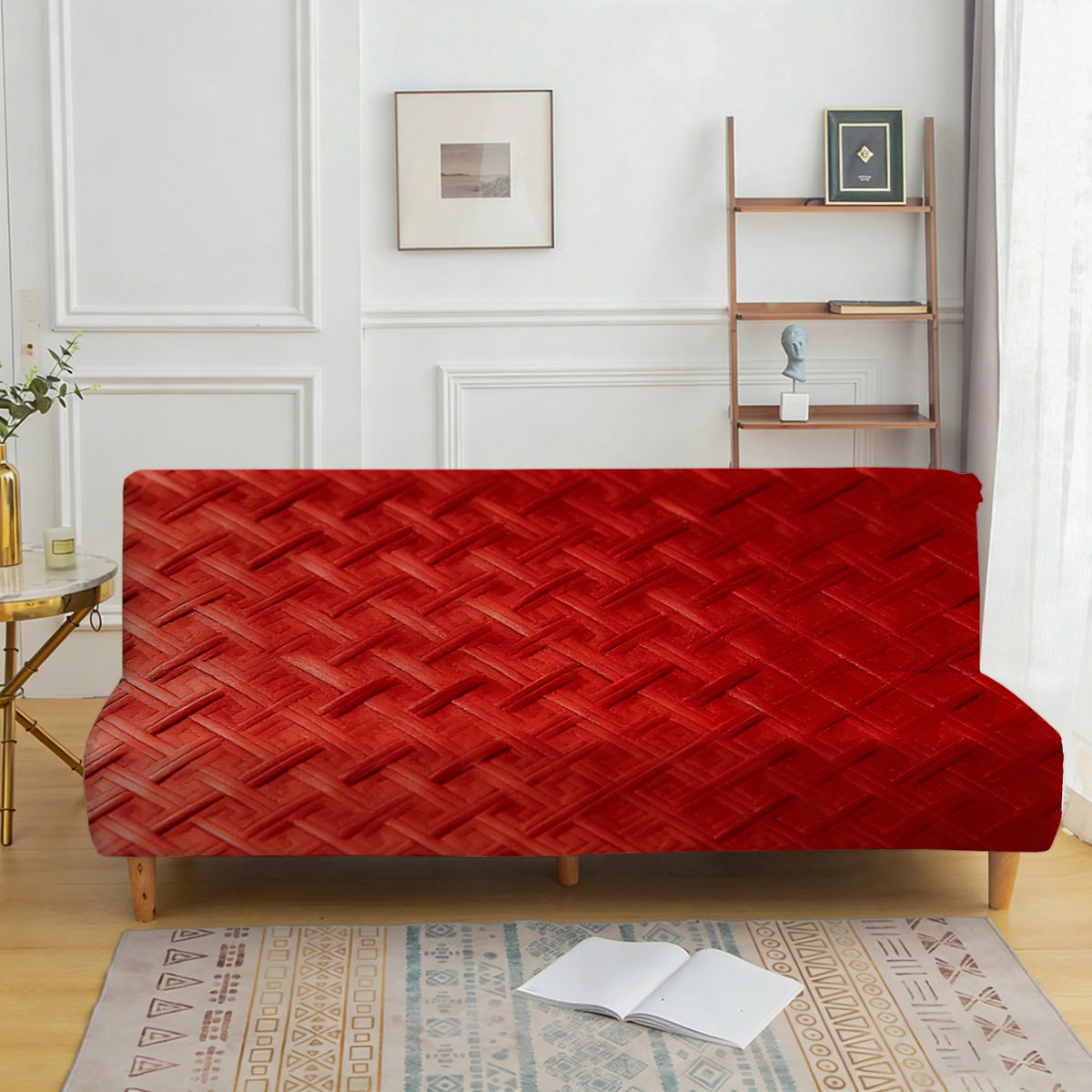 A vibrant red velvet armless sofa cover displayed on a wooden frame in a bright room.